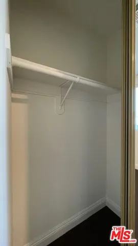 a view of an empty room and a window