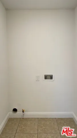 an empty room with closet area