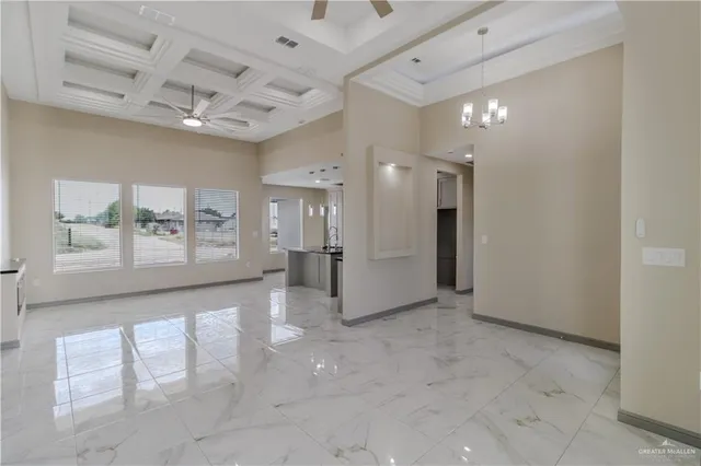 a kitchen with stainless steel appliances granite countertop a sink and a refrigerator