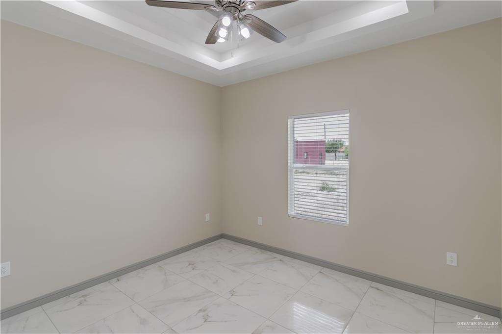 216 Nazareth Street Rio Grande City, TX 78582 - Photo 7 of 14 a view of an empty room with a window