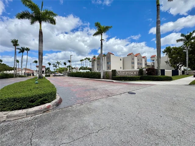 a view of a street with a building in the background