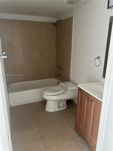 a bathroom with a toilet a sink and a shower