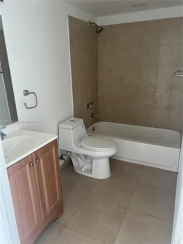 a bathroom with a sink a toilet and a bathtub