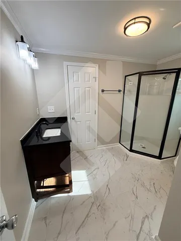 a bathroom with a bathtub toilet and a shower