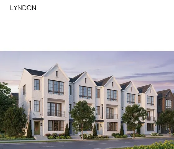 a front view of residential houses with yard and trees