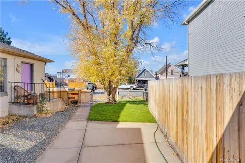 a view of a backyard with sitting area