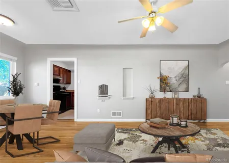 a living room with furniture and a window