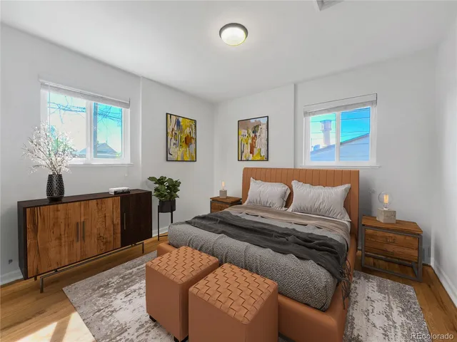 a bedroom with a bed and couch