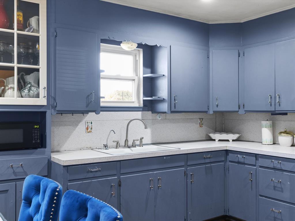 1805 Stevens Street Bridgeport, TX 76426 - Photo 12 of 24 a kitchen with a sink cabinets and window