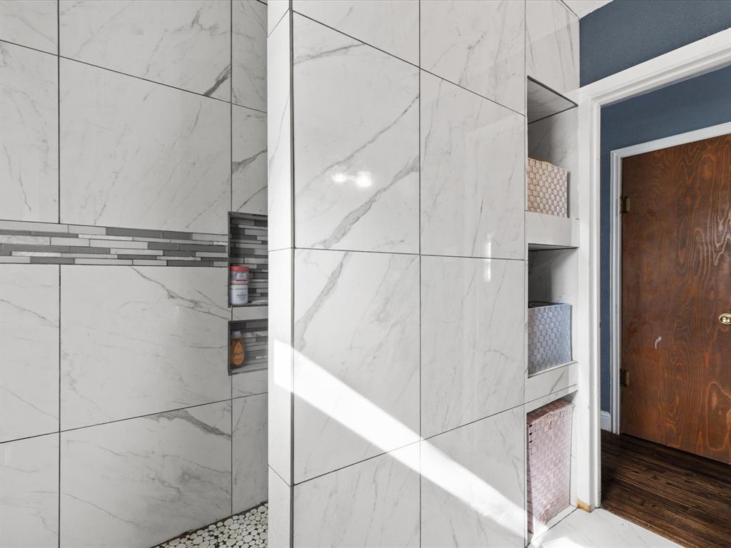 1805 Stevens Street Bridgeport, TX 76426 - Photo 15 of 24 a bathroom with a glass shower door