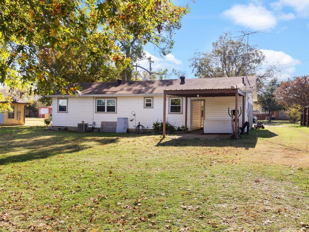 1805 Stevens Street Bridgeport, TX 76426 - Photo 18 of 24 a view of a house with a yard covered with snow in the background
