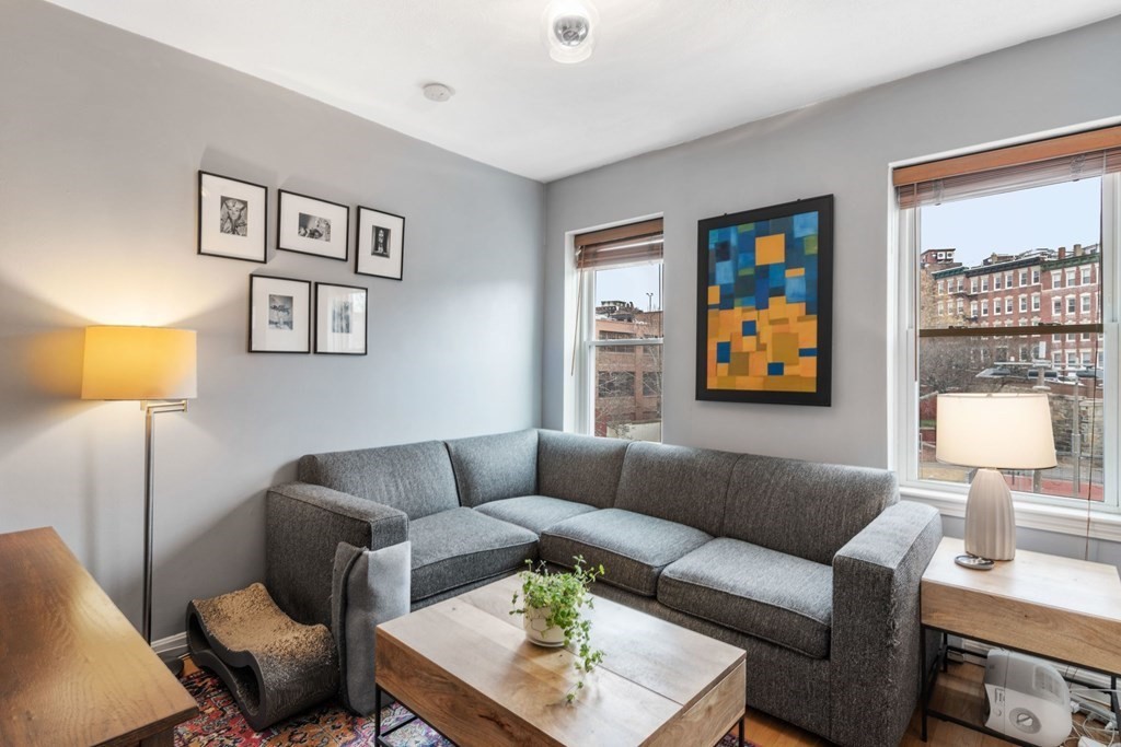 136 Prince Street, Unit 6 Boston, MA 02113 - Photo 1 of 14 a living room with furniture and a lamp