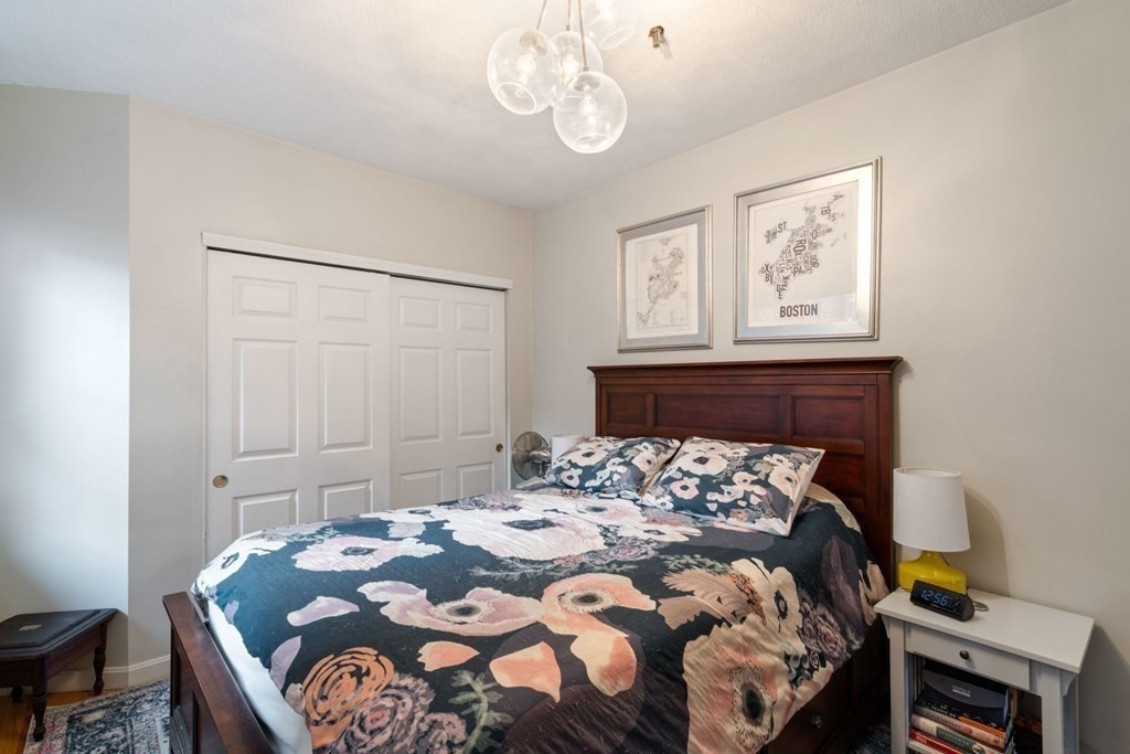 136 Prince Street, Unit 6 Boston, MA 02113 - Photo 6 of 14 a bed sitting in a bedroom next to a window