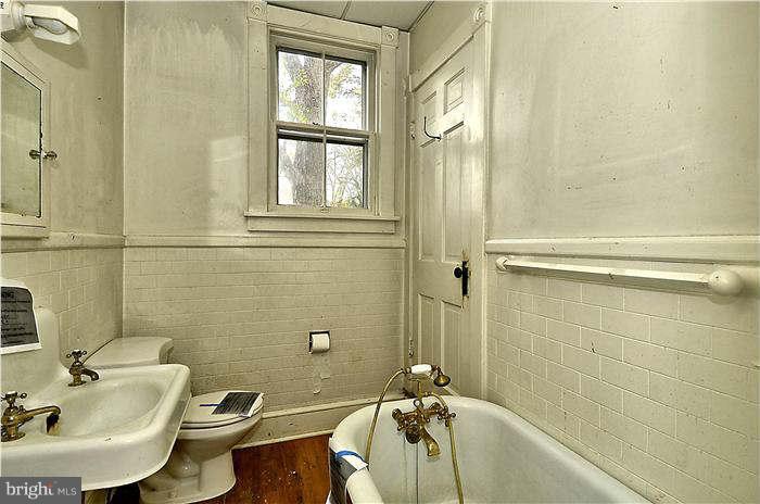 3653 Point Of Rocks Road Jefferson, MD 21755 - Photo 16 of 27 a bathroom with a sink a toilet and shower