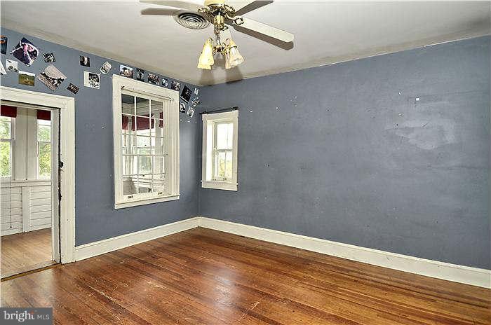 3653 Point Of Rocks Road Jefferson, MD 21755 - Photo 17 of 27 a view of an empty room with wooden floor and a window