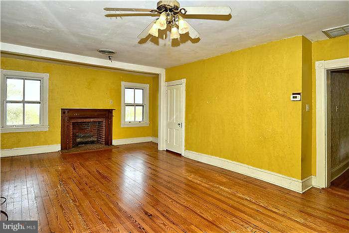 3653 Point Of Rocks Road Jefferson, MD 21755 - Photo 18 of 27 a view of an empty room with wooden floor and a window