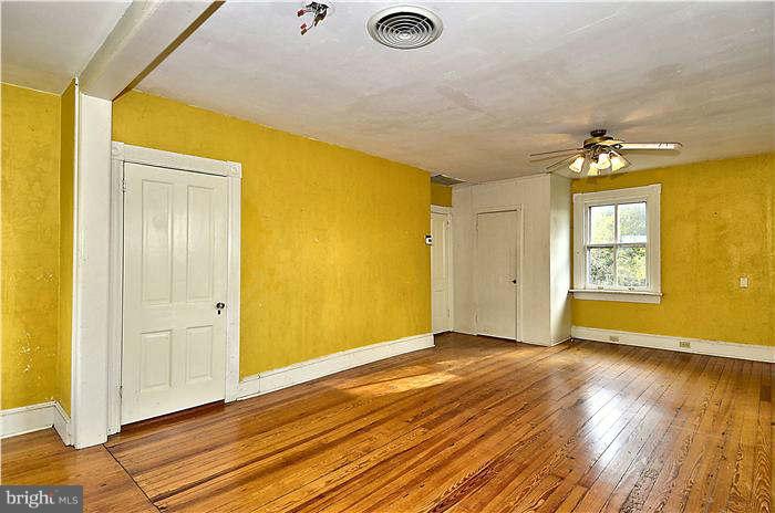 3653 Point Of Rocks Road Jefferson, MD 21755 - Photo 19 of 27 a view of livingroom with hardwood floor and a ceiling fan