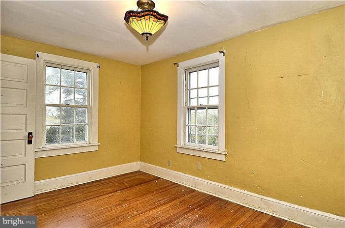 3653 Point Of Rocks Road Jefferson, MD 21755 - Photo 21 of 27 a view of an empty room with a window and wooden floor