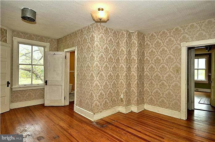 3653 Point Of Rocks Road Jefferson, MD 21755 - Photo 23 of 27 a view of a livingroom with wooden floor and a window
