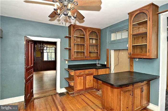 3653 Point Of Rocks Road Jefferson, MD 21755 - Photo 3 of 27 a kitchen with a sink a chandelier and living room view