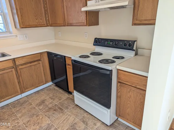 a kitchen with a stove and a microwave