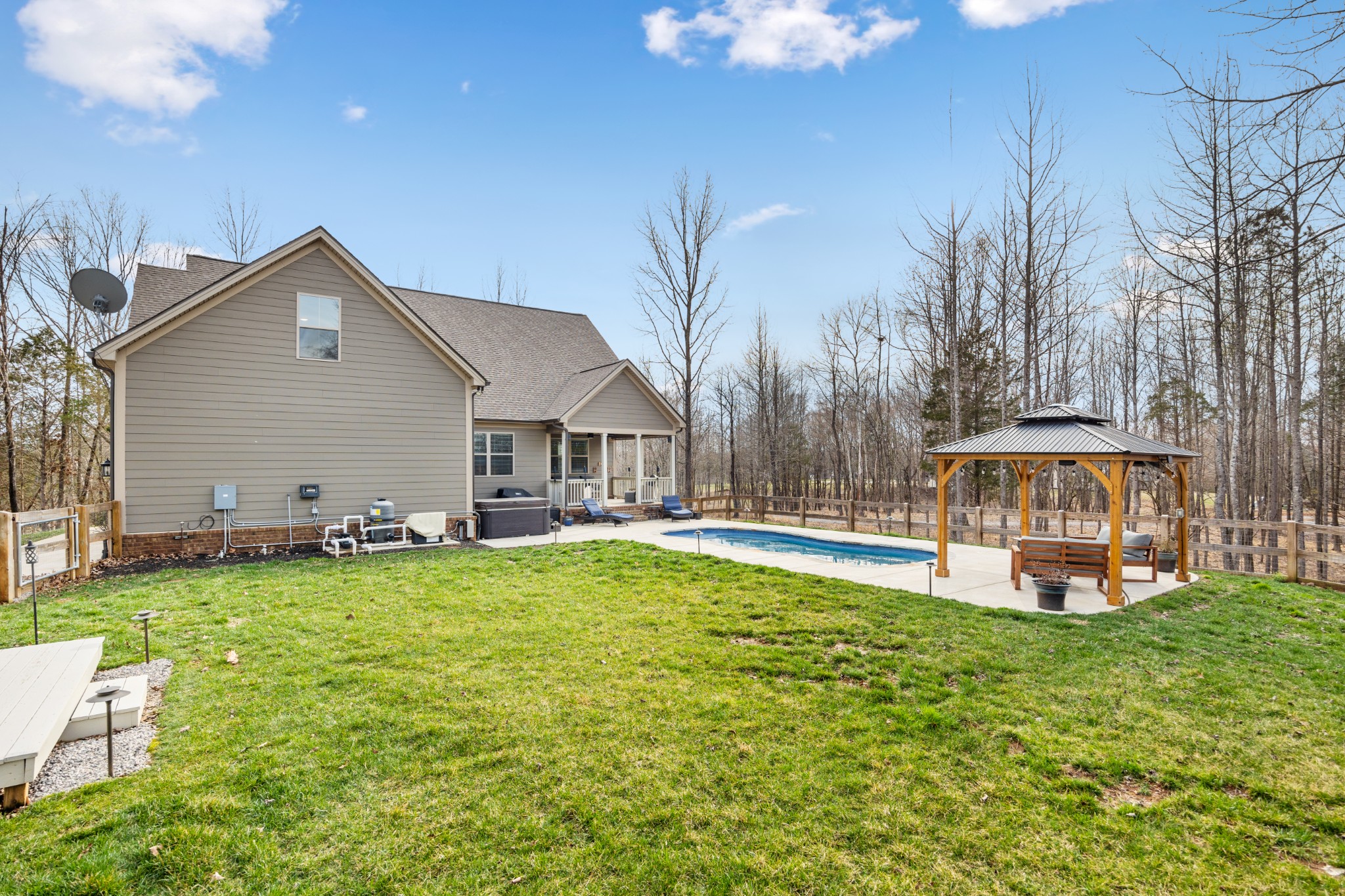 587 Flippen Road Lebanon, TN 37087 - Photo 8 of 40 a view of a house with a yard patio and swimming pool