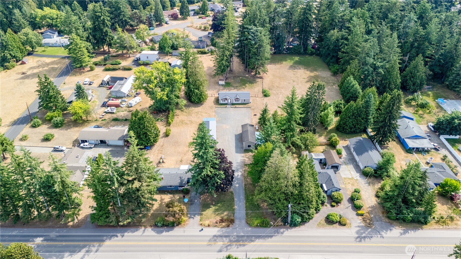1229 West Axton Road Ferndale, WA 98248 - Photo 2 of 40 an aerial view of lake residential house with outdoor space and trees all around