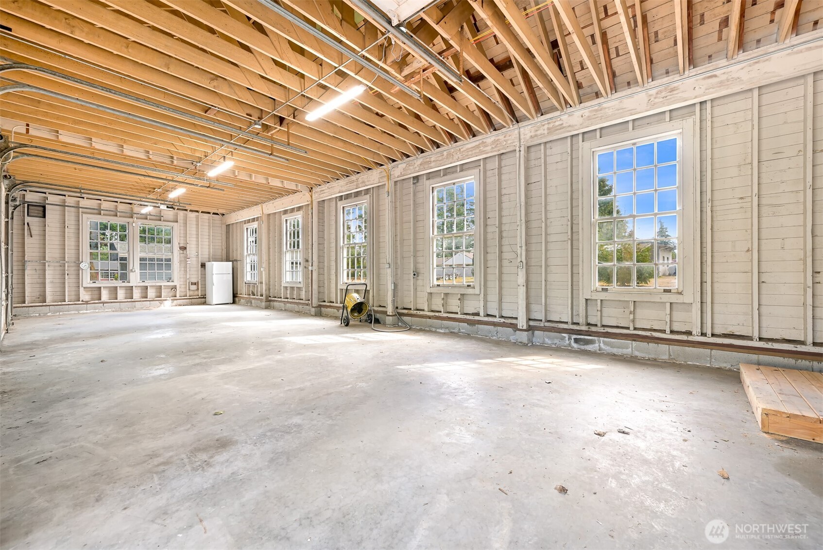 1229 West Axton Road Ferndale, WA 98248 - Photo 33 of 40 a view of an empty room with wooden floor and a window