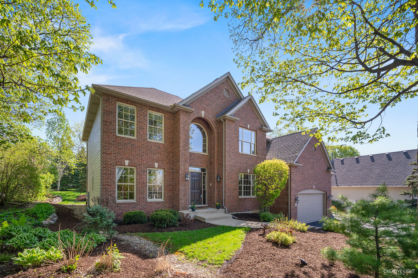 8 Winthrop New Road Sugar Grove, IL 60554 - Photo 1 of 38 a front view of a house with garden