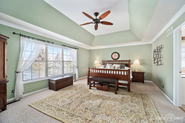 8 Winthrop New Road Sugar Grove, IL 60554 - Photo 17 of 38 a view of a livingroom with a table and a rug