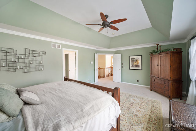 8 Winthrop New Road Sugar Grove, IL 60554 - Photo 18 of 38 a bedroom with a bed dresser and a window