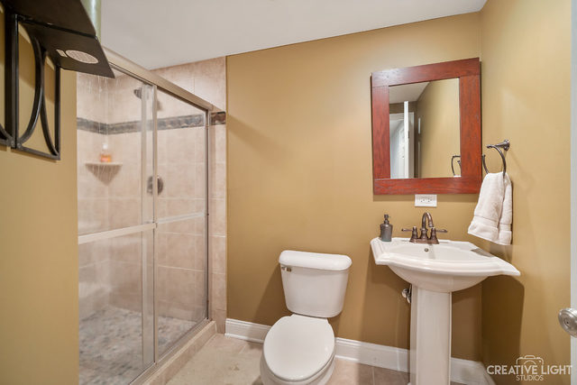 8 Winthrop New Road Sugar Grove, IL 60554 - Photo 27 of 38 a bathroom with a toilet sink and shower