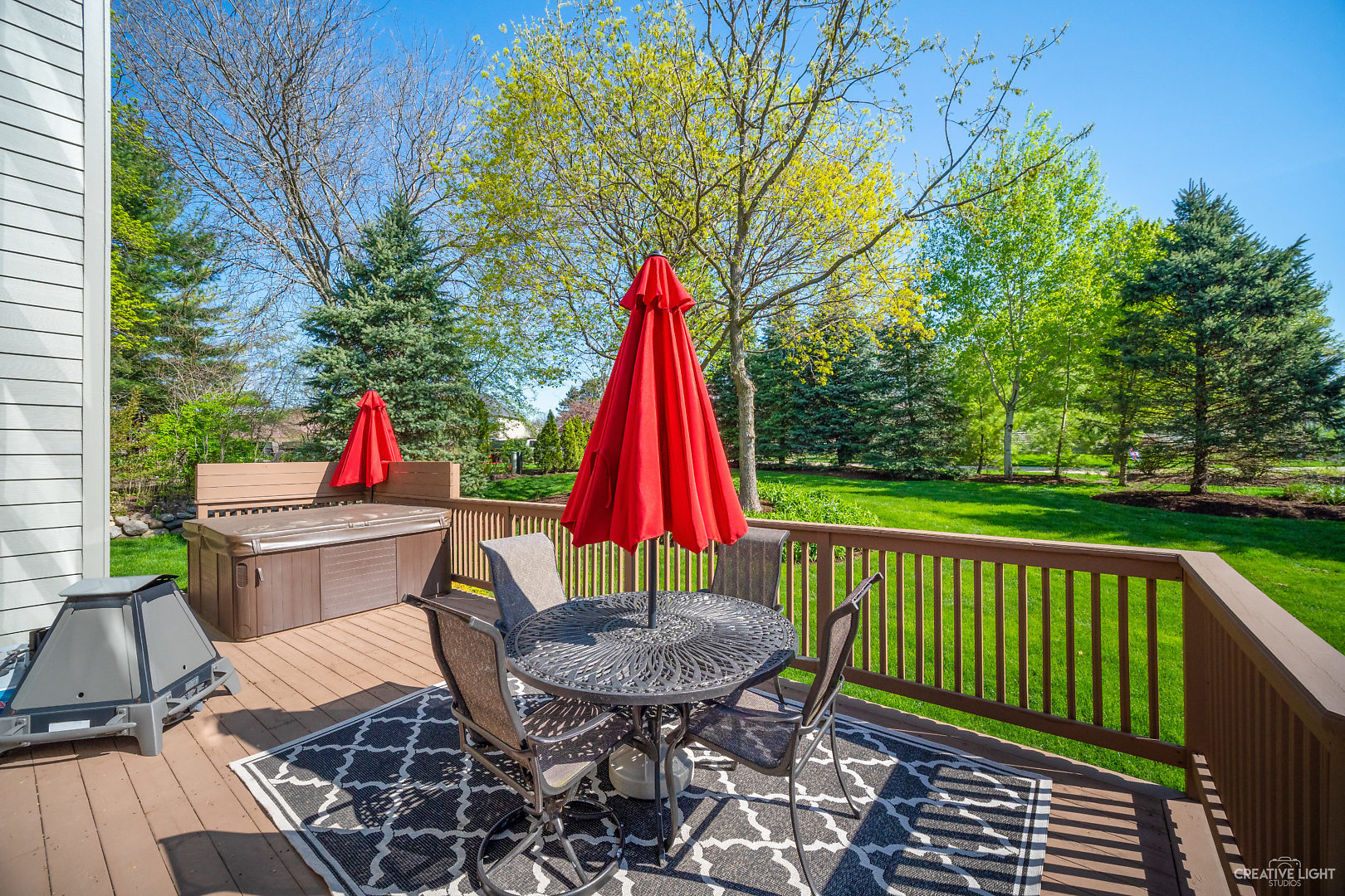 8 Winthrop New Road Sugar Grove, IL 60554 - Photo 30 of 38 a view of a deck with a table and chairs and wooden floor