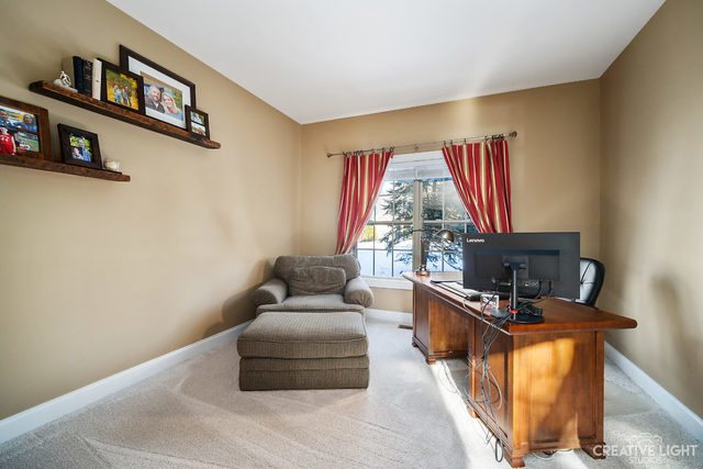 8 Winthrop New Road Sugar Grove, IL 60554 - Photo 9 of 38 a living room with furniture and a flat screen tv
