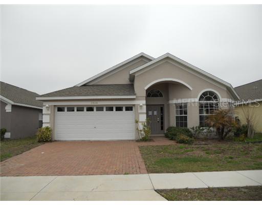 3034 Rob Way Kissimmee, FL 34743 - Photo 1 of 1 a front view of a house with garden