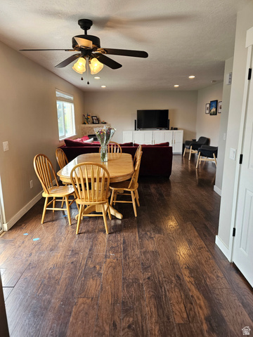 7481 Red Pine Road Eagle Mountain, UT 84005 - Photo 7 of 38 Open-concept living space featuring wood-finish flooring