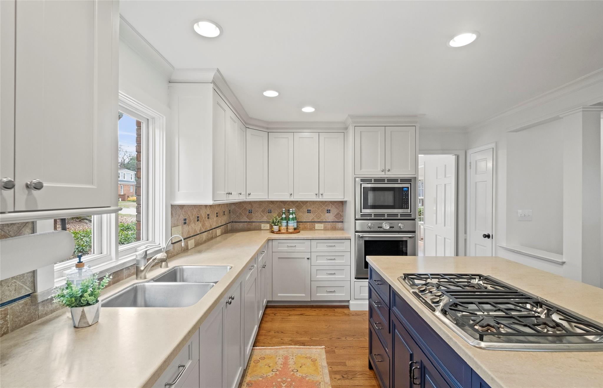3136 Clarendon Road Charlotte, NC 28211 - Photo 11 of 47 a kitchen with a sink stove top oven and refrigerator