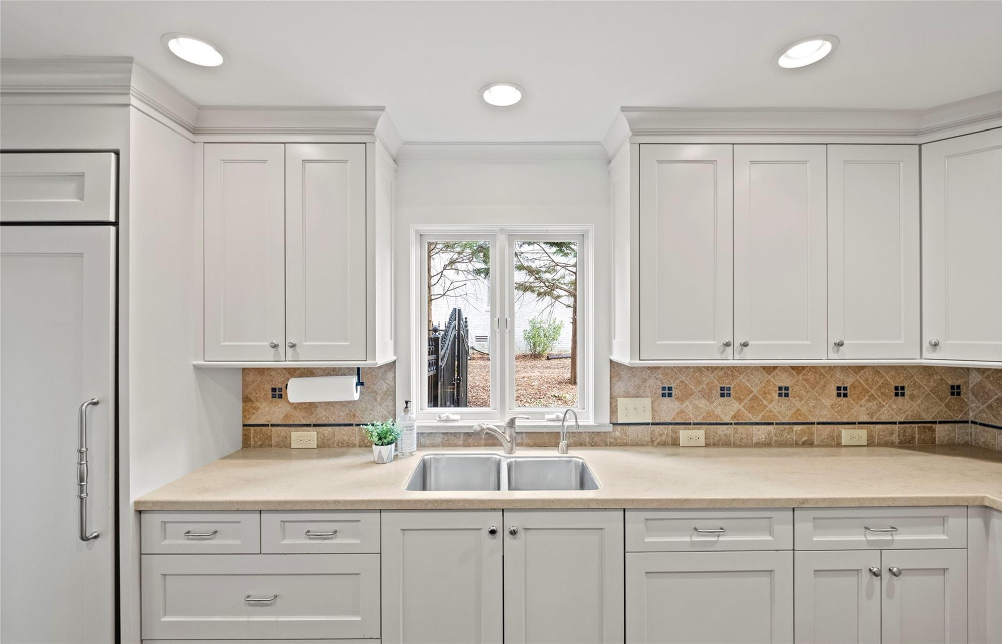 3136 Clarendon Road Charlotte, NC 28211 - Photo 12 of 47 a kitchen with stainless steel appliances granite countertop a sink and a white cabinets