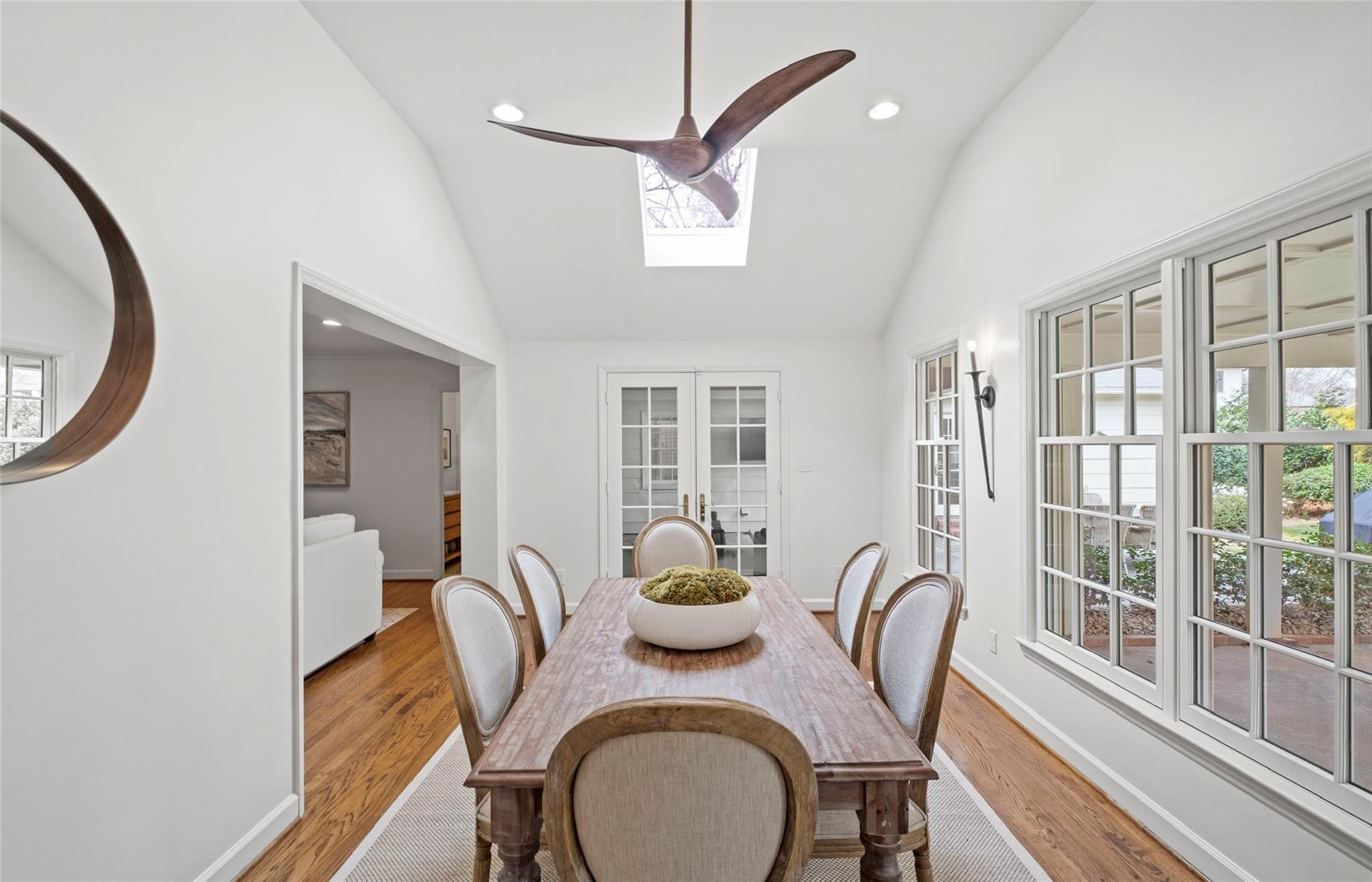 3136 Clarendon Road Charlotte, NC 28211 - Photo 17 of 47 a dining room with furniture a potted plant and wooden floor