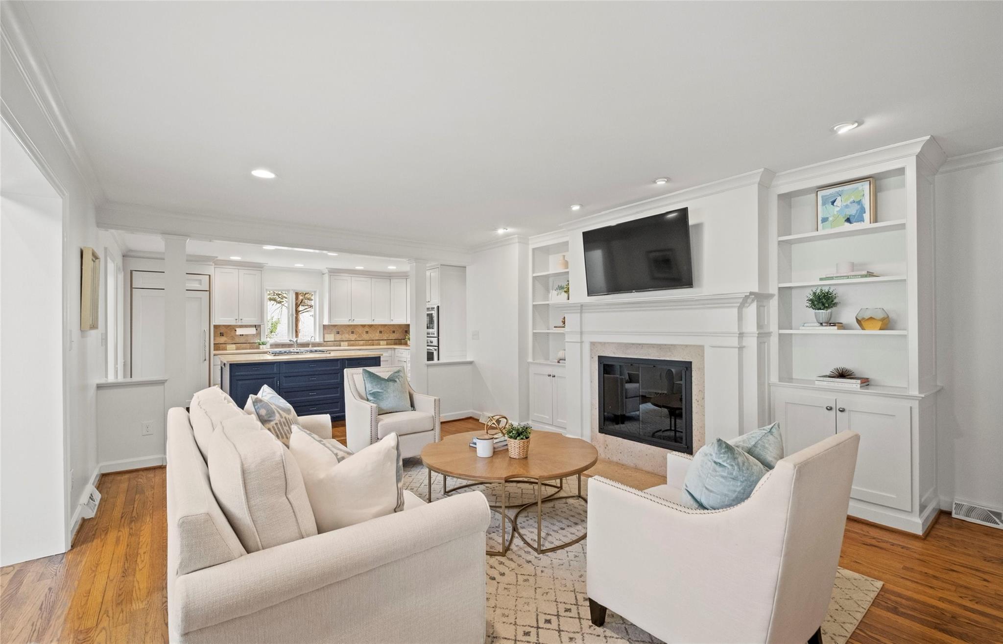 3136 Clarendon Road Charlotte, NC 28211 - Photo 19 of 47 a living room with furniture a fireplace and a flat screen tv