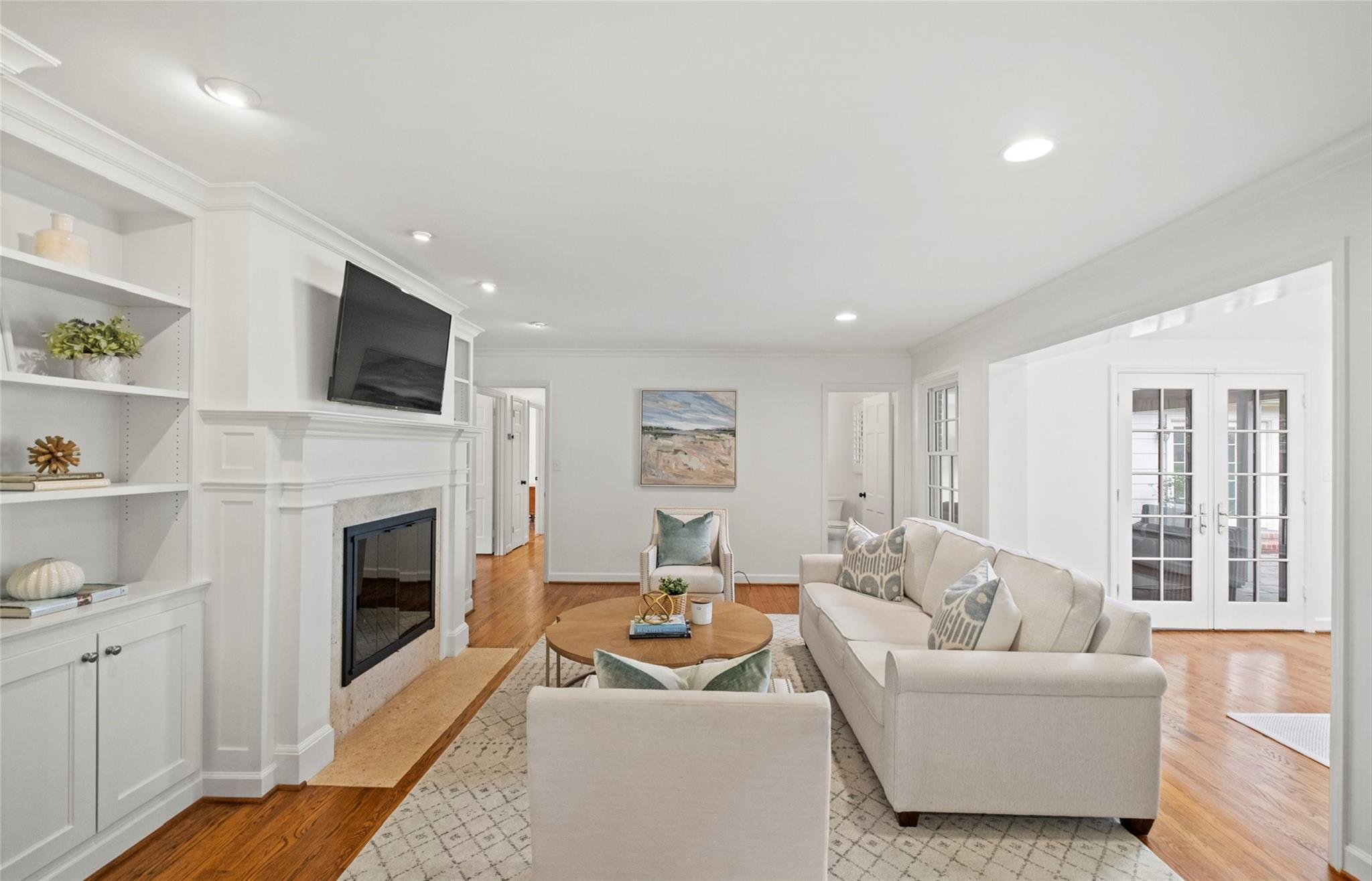 3136 Clarendon Road Charlotte, NC 28211 - Photo 20 of 47 a living room with furniture a fireplace and a flat screen tv