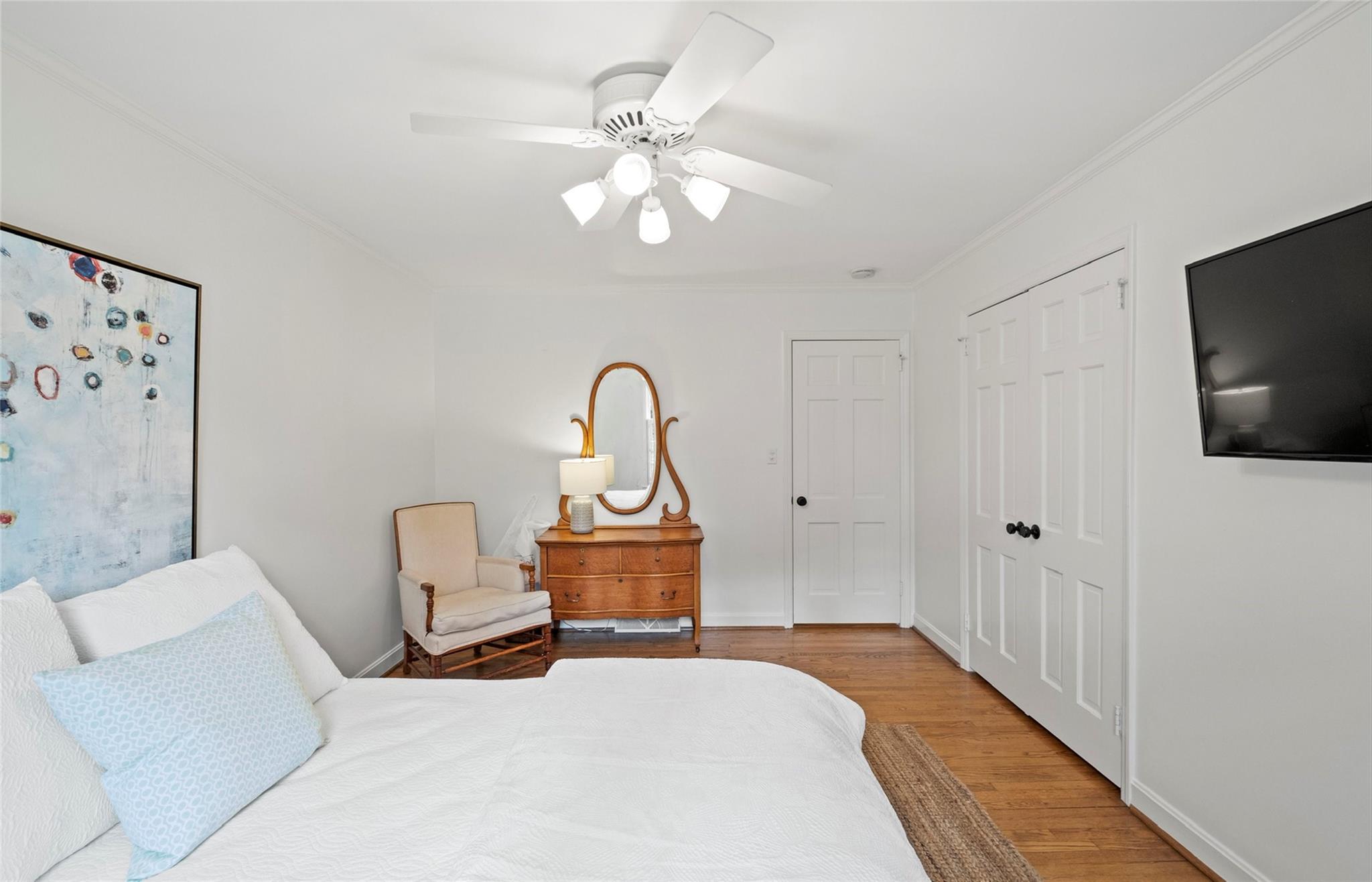 3136 Clarendon Road Charlotte, NC 28211 - Photo 23 of 47 a bedroom with a bed and a flat screen tv