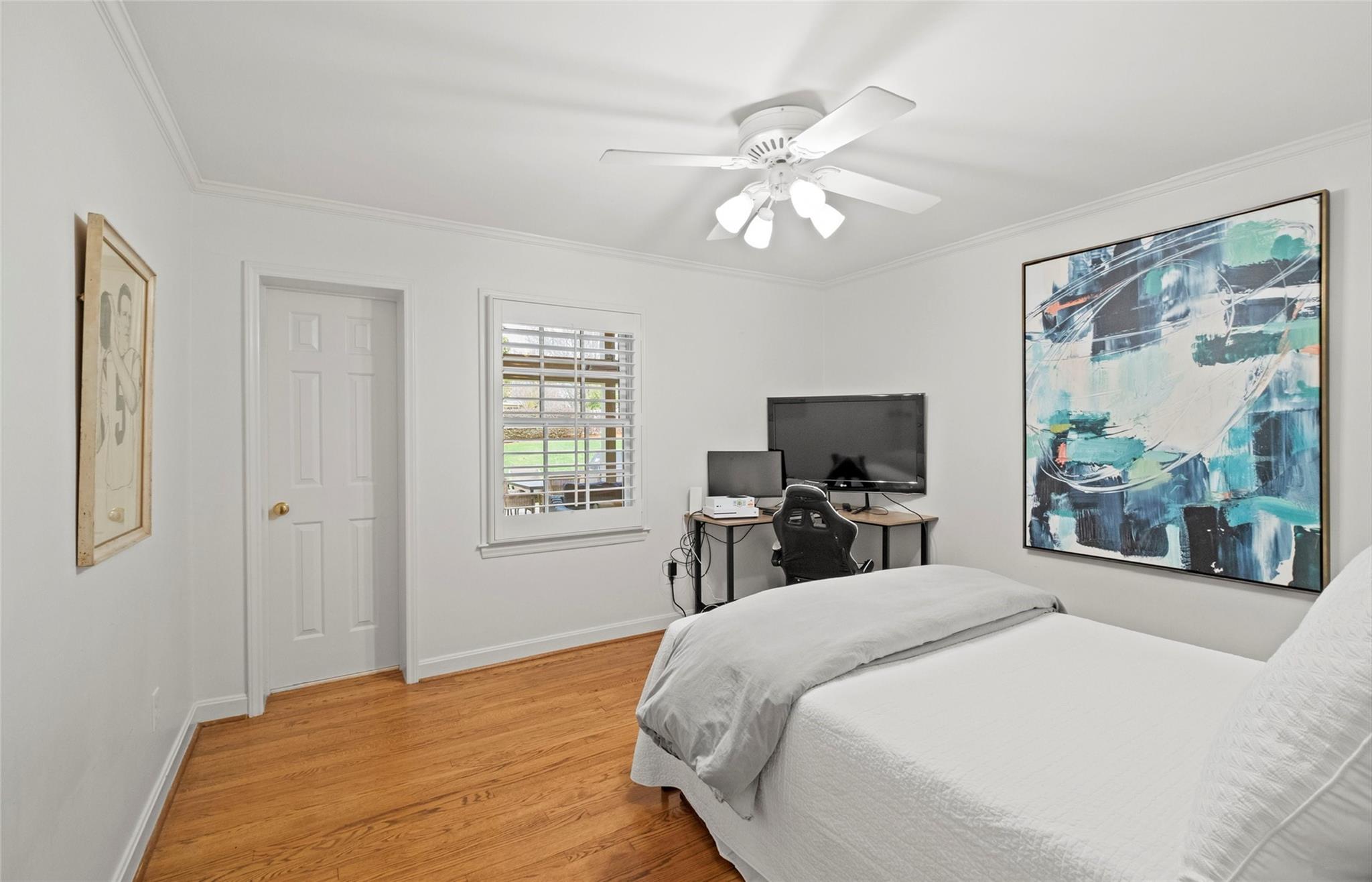 3136 Clarendon Road Charlotte, NC 28211 - Photo 25 of 47 a bedroom with a bed and a flat tv screen on dresser