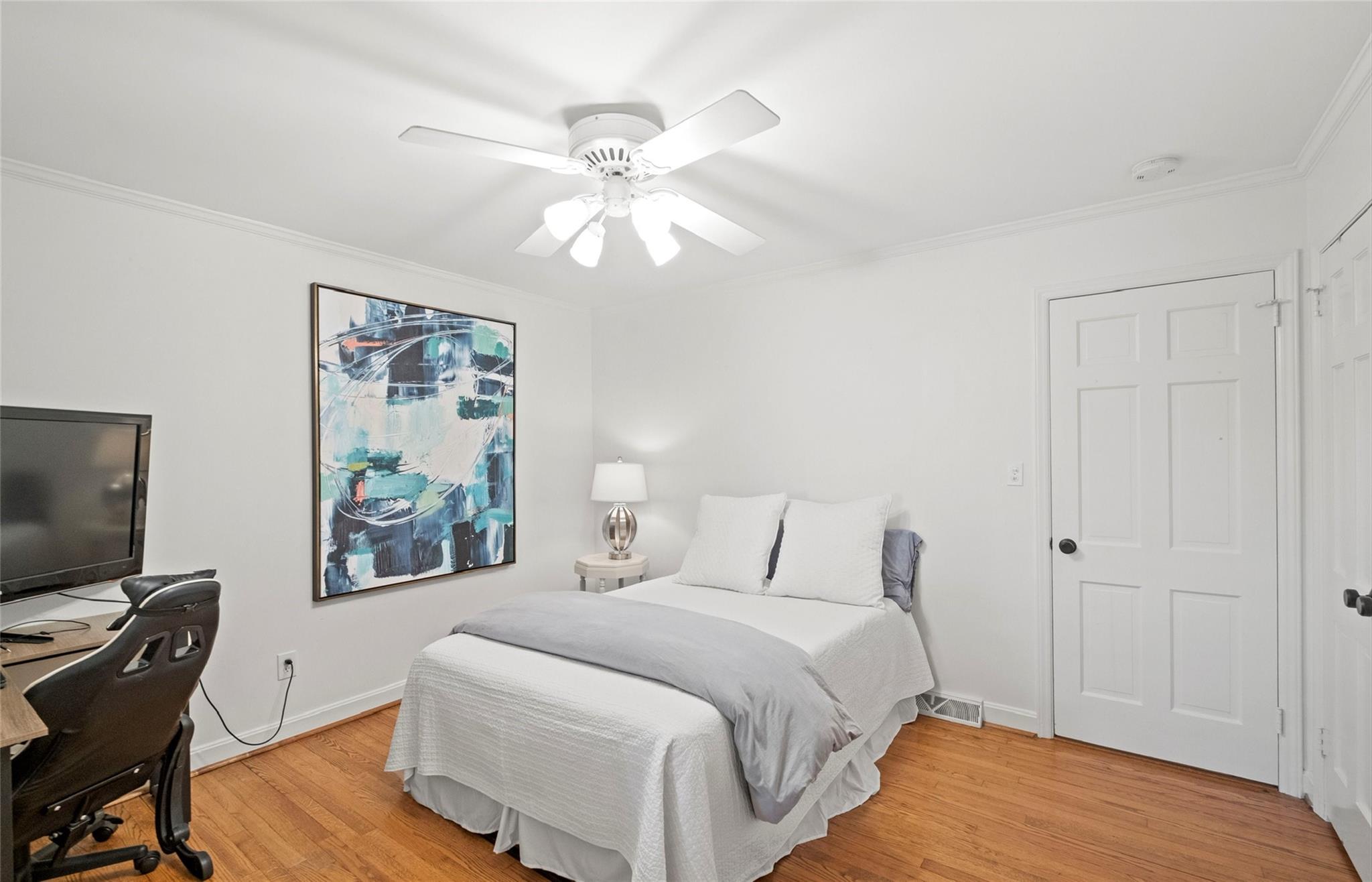 3136 Clarendon Road Charlotte, NC 28211 - Photo 26 of 47 a bedroom with a bed and a flat screen tv