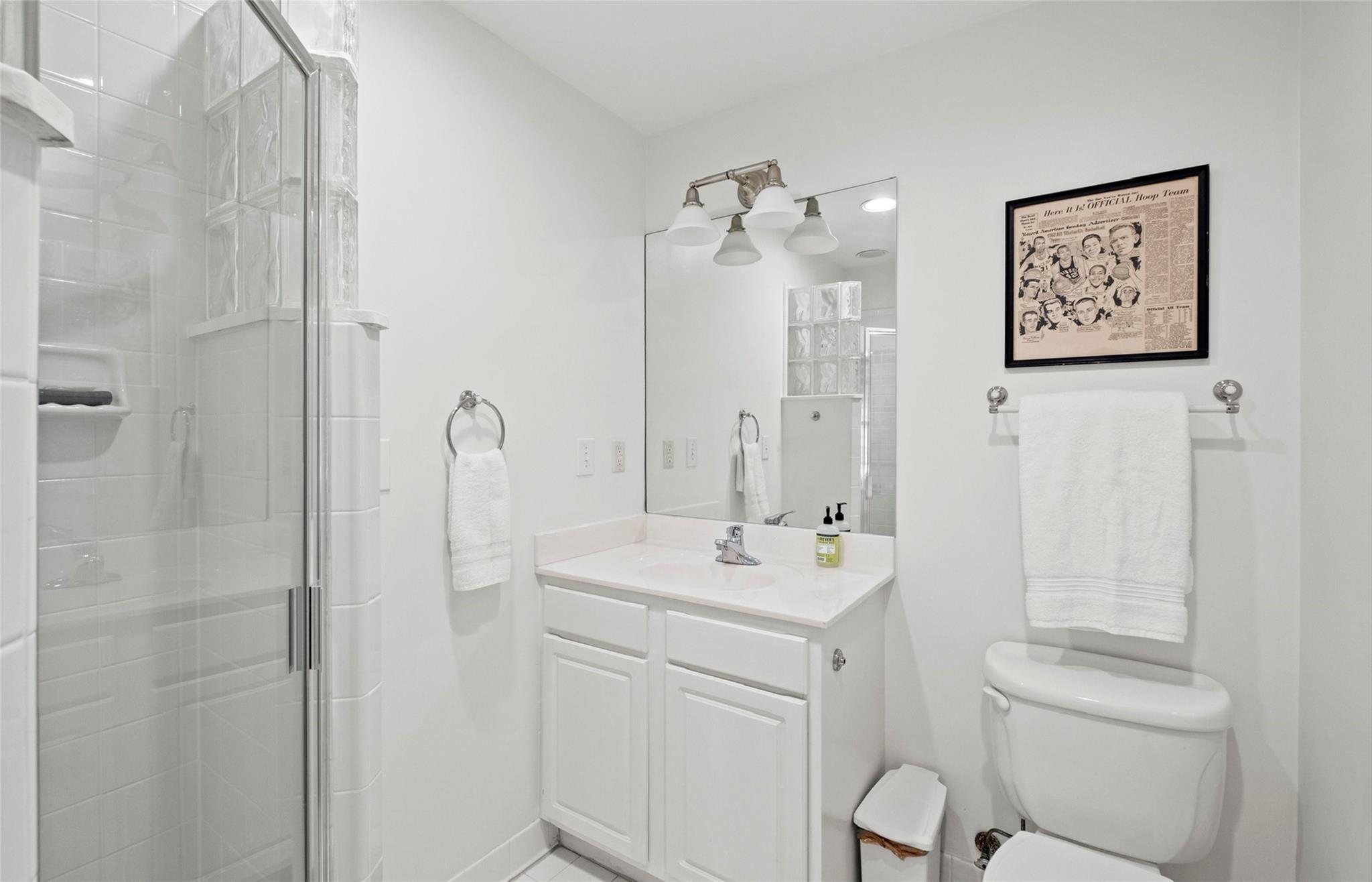 3136 Clarendon Road Charlotte, NC 28211 - Photo 27 of 47 a bathroom with a sink a toilet and shower