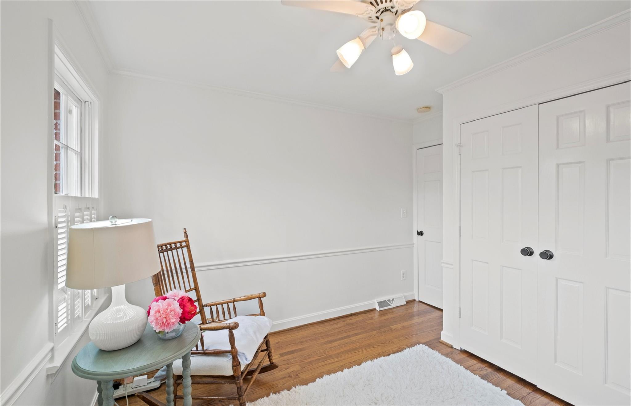 3136 Clarendon Road Charlotte, NC 28211 - Photo 32 of 47 a bedroom with a bed and a chandelier