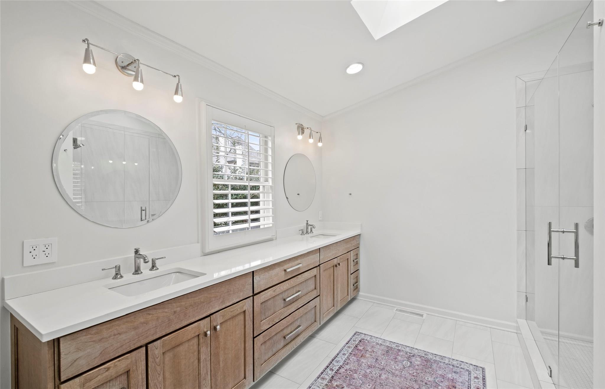 3136 Clarendon Road Charlotte, NC 28211 - Photo 36 of 47 a bathroom with a double vanity sink and a mirror