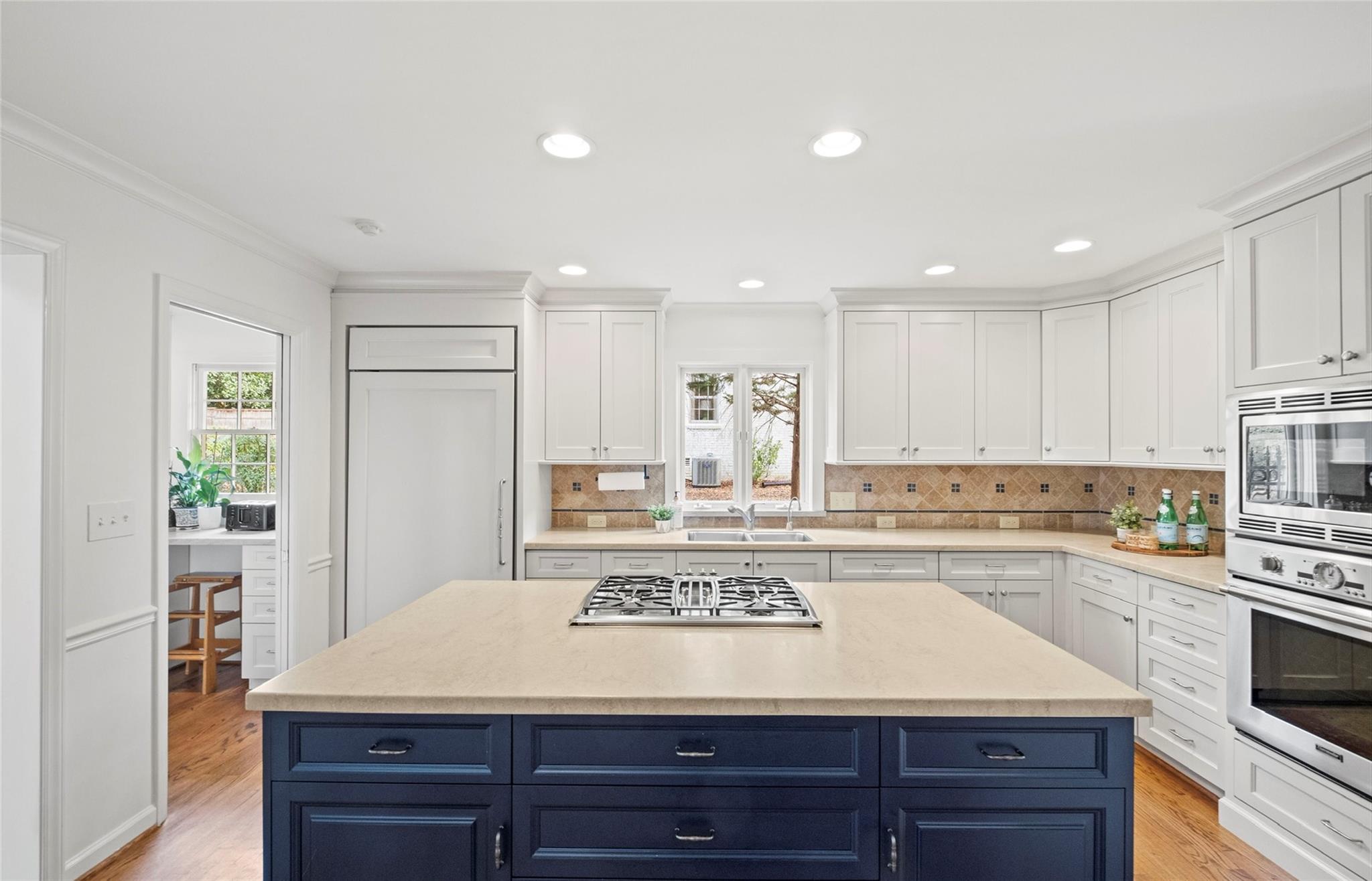 3136 Clarendon Road Charlotte, NC 28211 - Photo 8 of 47 a view of a kitchen with kitchen island and stainless steel appliances