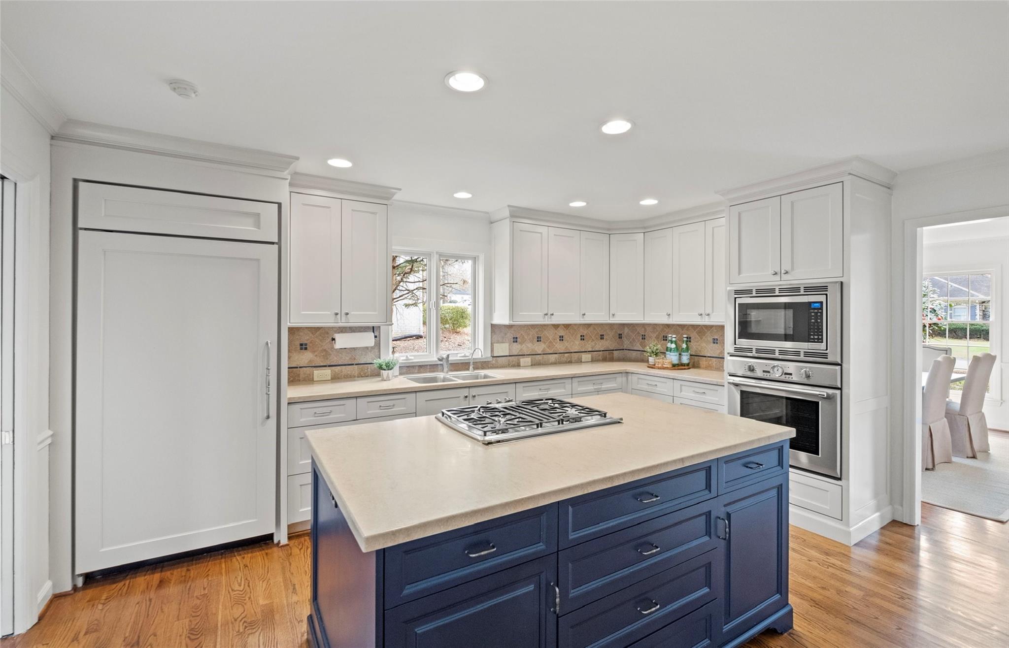 3136 Clarendon Road Charlotte, NC 28211 - Photo 9 of 47 a kitchen with a stove a sink and a refrigerator