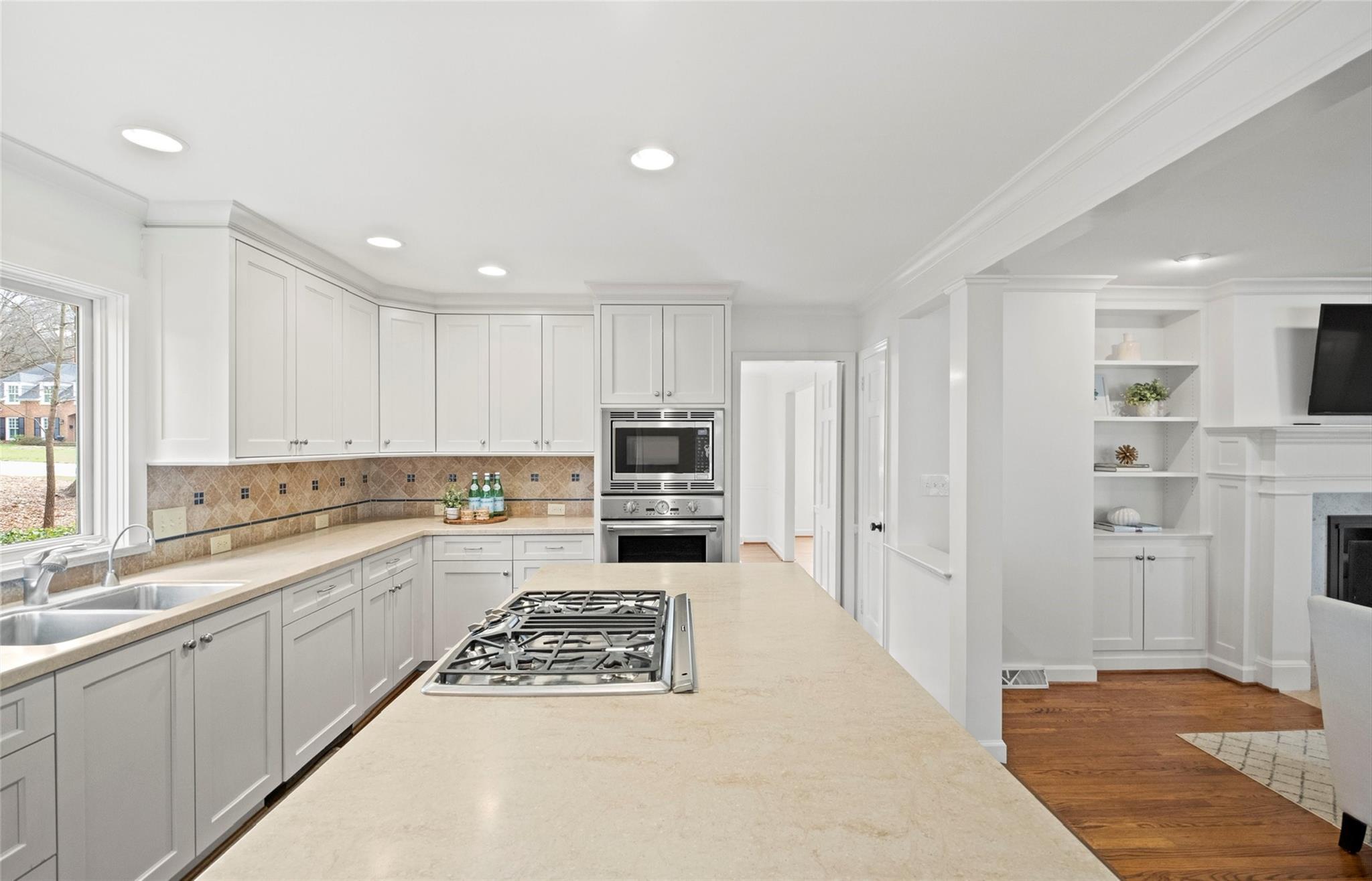 3136 Clarendon Road Charlotte, NC 28211 - Photo 10 of 47 a kitchen with a sink and a stove top oven